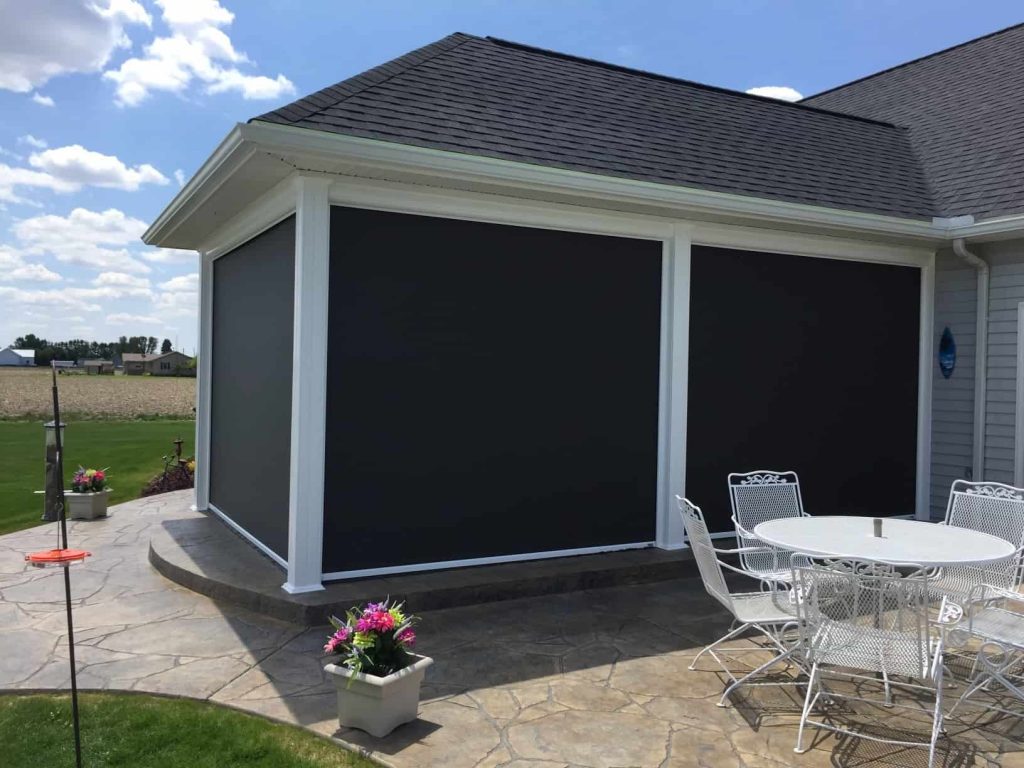 Outdoor patio with sun shade down on all sides providing complete protection and superior privacy